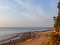 Sandstone cliffs on the seashore, beautiful reflections in the water