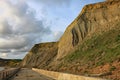 The sandstone cliffs at West Bay in Dorset, England. This is part of the Jurassic coast which runs from Exmouth in Devon to Royalty Free Stock Photo