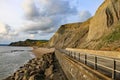 The sandstone cliffs at West Bay in Dorset, England. This is part of the Jurassic coast which runs from Exmouth in Devon to Royalty Free Stock Photo