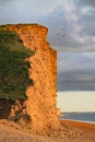 The sandstone cliffs at West Bay in Dorset, England. This is part of the Jurassic coast which runs from Exmouth in Devon to Royalty Free Stock Photo