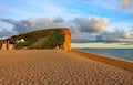 The sandstone cliffs at West Bay in Dorset, England. This is part of the Jurassic coast which runs from Exmouth in Devon to Royalty Free Stock Photo