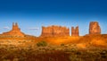 The sandstone formations of Mitten Buttes and Cly Butte in the desert landscape of Monument Valley Royalty Free Stock Photo