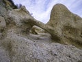 Sandstone magical humanoid and zoomorphic shapes on the beach. Royalty Free Stock Photo