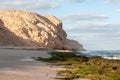 Sandstone mountain cliff on sea beach , Oman Royalty Free Stock Photo