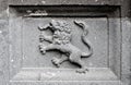 A lion or a gryphon carved in stone.
