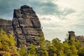 Sandstone rock formation the locomotive in German-Saxon Switzerland with climbers on the right Royalty Free Stock Photo