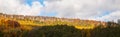 Sandstone rock formation in the middle of autumn forest Royalty Free Stock Photo