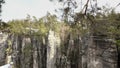 Sandstone rocks, rock massifs in forest. Climbing landscape, big stones