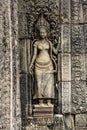 A sandstone sculpture of Apsara with a beautiful face and body at Bayon Angkor Thom Temple, Siem Reap Royalty Free Stock Photo