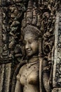 A sandstone sculpture of Apsara with a beautiful face and body at Bayon Angkor Thom Temple, Siem Reap Royalty Free Stock Photo