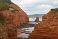 A sandstone sea stack at Ladram Bay near Sidmouth, Devon. Part of the south west coastal path. Sidmouth is visible in the