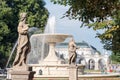 Sandstone statues and fountain in the Saxon Garden, Warsaw, Poland. Made before 1745 by anonymous Warsaw sculptor under the direct Royalty Free Stock Photo