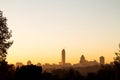 Sandton skyline at sunrise with trees silhouette