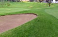 Sandtrap and Manicured grass of golf course Royalty Free Stock Photo