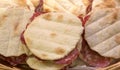 sandwhiches stuffed with sliced salami and for sale at the delic Royalty Free Stock Photo