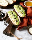 Sandwich with avocado, curd cheese, chia seeds and sesame seeds