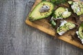 Sandwich with avocado, dark bread and white light cheese on wood Royalty Free Stock Photo