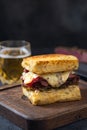 Sandwich with beef pastrami on wooden board Royalty Free Stock Photo