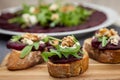 Sandwich with beetroot, beet carpaccio on the background