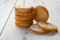 Sandwich biscuits with white cream filling on white wood