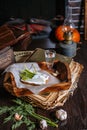 A sandwich of black bread and lard, lying on a tray of the tavern. Garlic, dill, a shot of vodka. Traditional Ukrainian snack