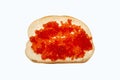 Sandwich with butter and red caviar on a white background. Royalty Free Stock Photo