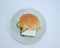 Top view of sandwich with cheese, tomato, cucumber, lettuce