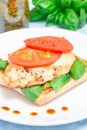 Sandwich with chicken, mozzarella, tomato, pesto and basil on toasted ciabatta, vertical Royalty Free Stock Photo