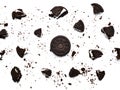 Sandwich chocolate cookies with a sweet cream with crumbs isolated on white background Royalty Free Stock Photo