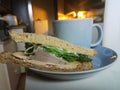Sandwich coffee cup on table