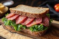 Sandwich consisting of two pieces of bread, mortadella sausage and green lettuce. Traditional Italian food, snack, fast food Royalty Free Stock Photo