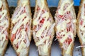 Sandwich with crab sticks and mayonnaise for sell at street food market in Thailand . Tasty sandwich close up Royalty Free Stock Photo