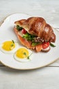 Sandwich with croissant, bagel, cream cheese and fried eggs Royalty Free Stock Photo