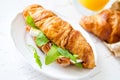 Sandwich croissant with ham brie arugula