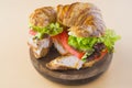 Sandwich of croissant of lettuce, tomato and smoked turkey