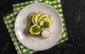 Sandwich with egg, avocado, radish greens on old background Royalty Free Stock Photo