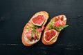 Sandwich with figs, prosciutto and cheese. Royalty Free Stock Photo