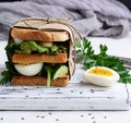 Sandwich of French toast and lettuce leaves and boiled egg Royalty Free Stock Photo