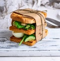 Sandwich of French toast and lettuce leaves and boiled egg Royalty Free Stock Photo