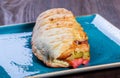 Sandwich from fresh pita bread with fillet grilled chicken, lettuce, slices of fresh tomatoes Royalty Free Stock Photo