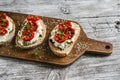 Sandwich with goat cheese, sun-dried tomatoes and thyme, served on the Board Royalty Free Stock Photo