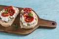 Sandwich with goat cheese, sun-dried tomatoes and thyme, served on the Board Royalty Free Stock Photo