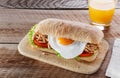 Sandwich with grilled meat egg tomato salad ciabatta Royalty Free Stock Photo