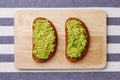 Sandwich with guacamole on light textile background top view sandwiches on wooden board