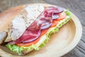 Sandwich with ham, cheese and fresh vegetables Royalty Free Stock Photo