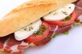Sandwich with ham, mozzarella and tomato