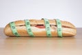 Sandwich with ham wrapped in measuring tape Royalty Free Stock Photo