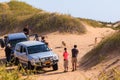 Tourists and jackals in the dunes of the Namib Desert, Swakopmund, Namibia