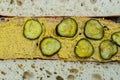 White bread baguette halves spread mustard pickles
