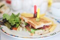 Sandwich with meet, bacon, cheese, French Fries, salad, vegetables, lettuce on a fresh sliced bread. Royalty Free Stock Photo